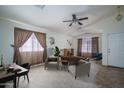 Staged living room with comfortable seating, providing an inviting space at 10618 W Pima St, Tolleson, AZ 85353