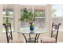 Cozy breakfast nook with a round table, decorative chairs, and natural light at 1330 W Butler Dr, Chandler, AZ 85224