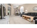 Spacious living room with neutral-colored walls, plush carpeting, and vaulted ceilings at 1330 W Butler Dr, Chandler, AZ 85224