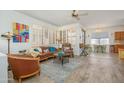 Inviting living room with hardwood floors, stylish furnishings, and natural light at 17449 N Fairway Dr, Surprise, AZ 85374