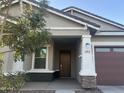 Charming single-story home featuring a covered porch and meticulously landscaped front yard at 20952 E Via Del Sol --, Queen Creek, AZ 85142