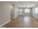 Bright living area with tiled floors, recessed lighting, a ceiling fan and a freshly painted gray walls at 4001 E Apollo Rd, Phoenix, AZ 85042