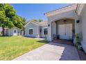 Charming home with a well-manicured lawn and a quaint front porch, perfect for relaxing at 5127 W Dobbins Rd, Laveen, AZ 85339