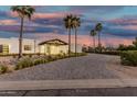 Beautiful desert home featuring modern architecture, a porte cochere, and desert landscaping at 6401 E Larkspur Dr, Scottsdale, AZ 85254