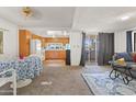 Bright living room showcasing open layout to the kitchen, a dining area, and comfortable furnishings at 701 S Dobson Rd # 438, Mesa, AZ 85202