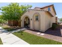 Inviting single-story home featuring desert landscaping, a covered entryway, and a tile roof at 9412 S 34Th Dr, Laveen, AZ 85339