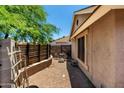 Cozy outdoor patio featuring brick pavers, privacy fence, and seating area at 10211 W Hazelwood Ave, Phoenix, AZ 85037