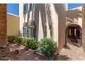 Front entryway featuring brick pavers and lush landscaping at 1036 N Sierra Hermosa Dr, Litchfield Park, AZ 85340