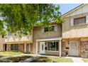 Traditional townhouse with brick and beige exterior and covered front porch, offering classic curb appeal at 18 E Hermosa Dr # 18, Tempe, AZ 85282