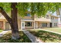 Traditional townhouse with brick and beige exterior and covered front porch, offering classic curb appeal at 18 E Hermosa Dr # 18, Tempe, AZ 85282