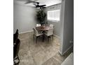Cozy dining area featuring modern chandelier, dining table, and bright natural lighting at 2726 W Butler Dr, Phoenix, AZ 85051