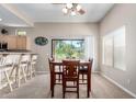 Inviting dining area featuring a wooden table set and a view to the outdoor space at 3041 E Fremont Rd, Phoenix, AZ 85042