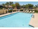 Community swimming pool offers a refreshing escape with ample seating for residents at 3041 E Fremont Rd, Phoenix, AZ 85042