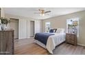 Cozy bedroom features a large closet, wood-look floors and plenty of natural light at 320 E Mckellips Rd # 46, Mesa, AZ 85201