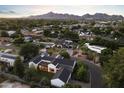 Expansive aerial view of a luxury home with a sprawling backyard oasis at 3825 E Coolidge St, Phoenix, AZ 85018