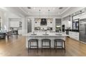 Bright, modern kitchen with white cabinets and oversized island with seating at 3825 E Coolidge St, Phoenix, AZ 85018
