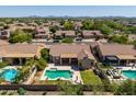 Picture of a home from above showcasing a pool, landscaped yard, and neighborhood at 4010 E Hamblin Dr, Phoenix, AZ 85050