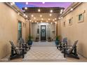 Cozy outdoor patio with seating area and decorative string lights overhead at 17850 E Bronco Ct, Queen Creek, AZ 85142