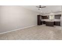 Kitchen with stainless steel appliances, center island, and dark wood cabinets at 2000 N 36Th St # 19, Phoenix, AZ 85008