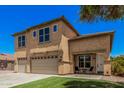 Charming two-story home with a well-manicured front lawn at 3016 W White Canyon Rd, San Tan Valley, AZ 85144
