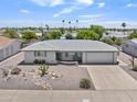 Aerial view of a desert home, featuring low maintenance landscaping and an attached one-car garage at 6263 E Duncan St, Mesa, AZ 85205