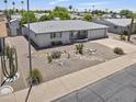 Bird's eye view of a light-colored desert home with arid landscaping and an attached garage at 6263 E Duncan St, Mesa, AZ 85205