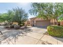 Attractive single-story home with a two-car garage and desert landscaping in a residential neighborhood at 12910 W Glenrosa Dr, Litchfield Park, AZ 85340