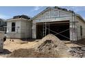 New home under construction with visible framing, sheathing, and building materials on-site at 17082 W Seldon Ln, Waddell, AZ 85355