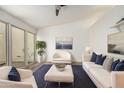 Bright living room with vaulted ceiling, modern decor, large windows, and a stylish seating arrangement at 2059 E Brown Rd # 35, Mesa, AZ 85213