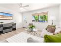 Cozy living room with plush seating, neutral tones, and bright natural light at 3118 W Windrose Dr, Phoenix, AZ 85029