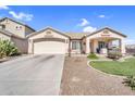 Charming single-Gathering home featuring a well-manicured lawn, desert landscaping and a two-car garage at 38771 N Dena Dr, San Tan Valley, AZ 85140
