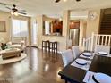 Open-concept living room with a dining area, leading to the kitchen and backyard at 4332 E Oakland St, Gilbert, AZ 85295