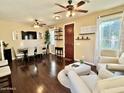 Spacious living room offers comfortable seating, a TV, and access to the dining area at 4332 E Oakland St, Gilbert, AZ 85295