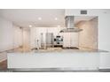 Stylish kitchen island with granite countertops, stainless steel appliances, and ample cabinet space at 7180 E Kierland Blvd # 507, Scottsdale, AZ 85254