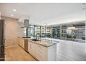 Modern kitchen with stainless steel appliances, granite counters, and large windows with lush exterior views at 7180 E Kierland Blvd # 507, Scottsdale, AZ 85254