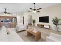 Inviting living space with an open layout, tile floors, and a view of the kitchen area at 12770 W Alvarado Rd, Avondale, AZ 85392