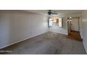 Spacious living room featuring neutral walls and carpet at 131 N Higley Rd # 215, Mesa, AZ 85205