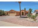 Inviting single-story home with mature landscaping, tile roof and neutral color palette at 18130 N 92Nd Ln, Peoria, AZ 85382