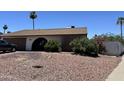 Beautiful single-story home with low maintenance desert landscaping and palm trees at 2719 W Carter Dr, Tempe, AZ 85282