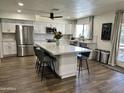 Bright kitchen with a large center island and stainless steel appliances at 2719 W Carter Dr, Tempe, AZ 85282