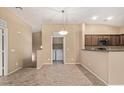 Open concept living room featuring a dining area, in-unit laundry, and neutral paint at 2725 E Mine Creek Rd # 2146, Phoenix, AZ 85024
