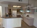 Kitchen with plenty of counter space and white appliances at 3428 E Renee Dr, Phoenix, AZ 85050