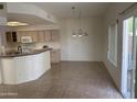 Spacious kitchen area with an open floor plan and adjacent dining space at 3428 E Renee Dr, Phoenix, AZ 85050