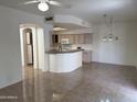 Bright, open-concept kitchen featuring a breakfast bar, and ample cabinet space at 3428 E Renee Dr, Phoenix, AZ 85050