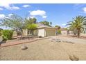 Charming single-Gathering home with a two-car garage, manicured lawn and mature trees at 3855 W Denver St, Chandler, AZ 85226