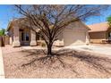 Charming single-story home featuring a two-car garage and covered front porch at 4942 W Novak Way, Laveen, AZ 85339