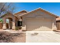 Charming single-story home featuring a two-car garage and covered front porch at 4942 W Novak Way, Laveen, AZ 85339