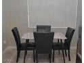 Elegant dining area with a marble-topped table and stylish seating for Gathering meals at 500 N Roosevelt Ave # 53, Chandler, AZ 85226