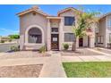 Charming townhome boasts a stucco exterior, tile roof, and well-maintained landscaping at 500 N Roosevelt Ave # 53, Chandler, AZ 85226