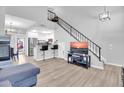 Open-concept living area with modern staircase and bar seating, ideal for entertaining at 500 N Roosevelt Ave # 53, Chandler, AZ 85226